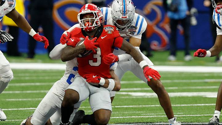 Jan 1, 2026; New Orleans, LA, USA; Georgia Bulldogs running back Nate Frazier (3) is injured while being tackled by Mississippi Rebels linebacker Tahj Chambers (26) in the fourth quarter during the 2026 Sugar Bowl and quarterfinal game of the College Football Playoff at Caesars Superdome. Mandatory Credit: Geoff Burke-Imagn Images