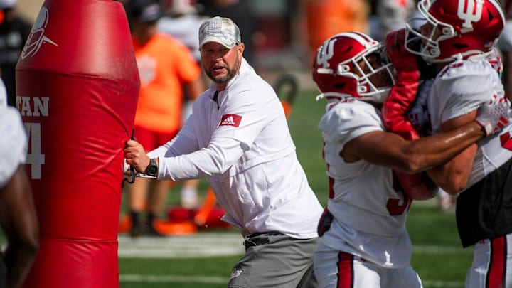 Indiana University Defensive Coordinator Bryant Haines instructs players during fall practice at the Mellencamp Pavilion at Indiana University on Friday, Aug. 16, 2024.
