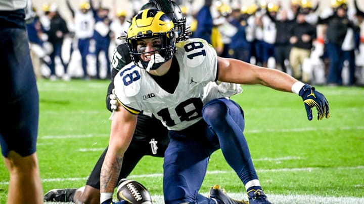 Michigan's Colston Loveland celebrates his touchdown against Michigan State during the second quarter on Saturday, Oct. 21, 2023, at Spartan Stadium in East Lansing.
