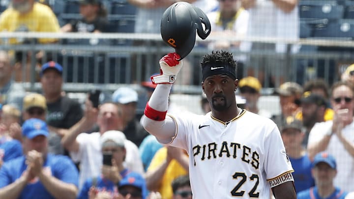 Jun 11, 2023; Pittsburgh, Pennsylvania, USA; Pittsburgh Pirates designated hitter Andrew McCutchen (22) tips his cap to the crowd after hitting a single to register his 2000th career major league hit during the first inning against the New York Mets at PNC Park. Mandatory Credit: Charles LeClaire-Imagn Images