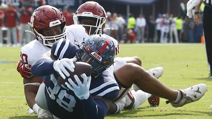 Mississippi Rebels defensive tackle JJ Pegues dives for a touchdown during the second half against the Oklahoma Sooners. Mississippi Rebels defensive tackle JJ Pegues dives for a touchdown during the second half against the Oklahoma Sooners.