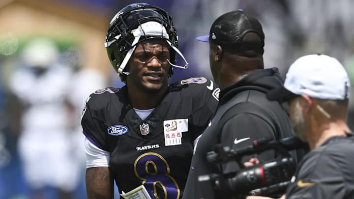 Jul 27, 2024; Owings Mill , MD, USA; Baltimore Ravens quarterback Lamar Jackson speaks with quarterback coach Tee Martin during the afternoon session of training camp at the Under Armour Performance Center, Mandatory Credit: Tommy Gilligan-Imagn Images Jul 27, 2024; Owings Mill , MD, USA; Baltimore Ravens quarterback Lamar Jackson speaks with quarterback coach Tee Martin during the afternoon session of training camp at the Under Armour Performance Center, Mandatory Credit: Tommy Gilligan-Imagn Images