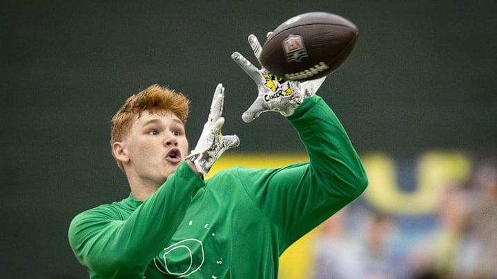 Oregon tight end Terrance Ferguson catches a pass from former Oregon quarterback Bo Nix during Oregon Pro Day Tuesday, March 12, 2024 at the Moshofsky Center in Eugene, Ore.