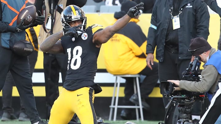 Dec 8, 2024; Pittsburgh, Pennsylvania, USA;  Pittsburgh Steelers wide receiver Mike Williams (18) reacts after a first down pass reception against the Cleveland Browns during the third quarter at Acrisure Stadium. Mandatory Credit: Charles LeClaire-Imagn Images