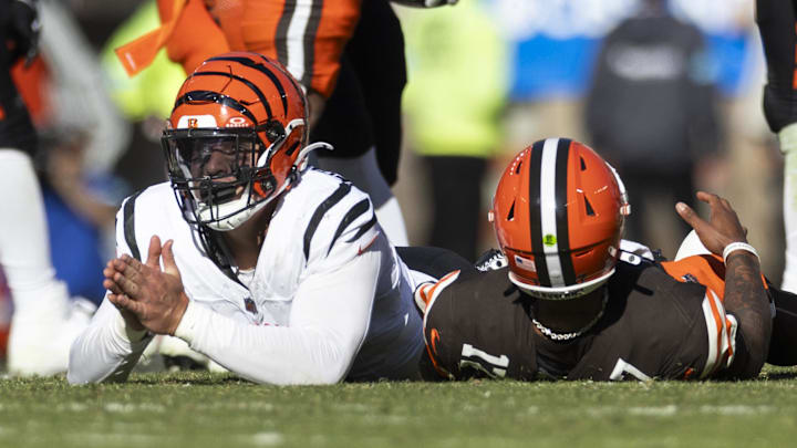 Oct 20, 2024; Cleveland, Ohio, USA; Cincinnati Bengals defensive end Trey Hendrickson (91) looks up after tackling Cleveland Browns quarterback Dorian Thompson-Robinson (17) during the fourth quarter at Huntington Bank Field. Mandatory Credit: Scott Galvin-Imagn Images