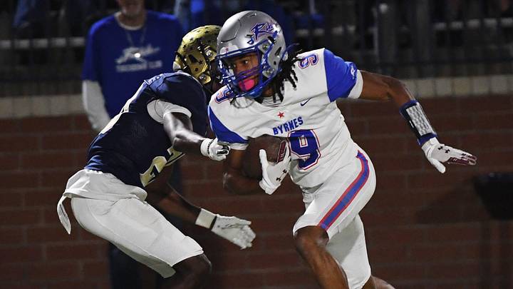 Byrnes' Chanin Harris (9) pulls down a ball and breaks down the field to the end zone. Byrnes' Chanin Harris (9) pulls down a ball and breaks down the field to the end zone.