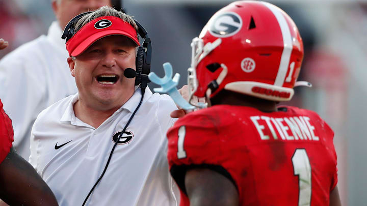 Georgia head coach Kirby Smart celebrates with Georgia running back Trevor Etienne (1) during the second half of a NCAA college football game against Auburn in Athens, Ga., on Saturday, Oct. 5, 2024. Georgia head coach Kirby Smart celebrates with Georgia running back Trevor Etienne (1) during the second half of a NCAA college football game against Auburn in Athens, Ga., on Saturday, Oct. 5, 2024.