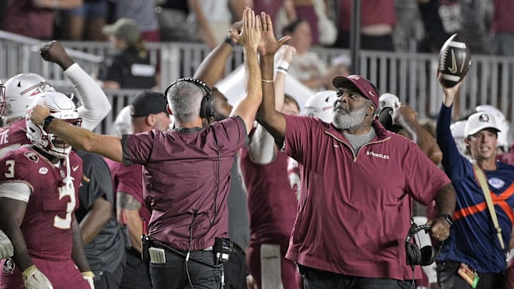 Sep 21, 2024; Tallahassee, Florida, USA; Florida State Seminoles head coach Mike Norvell and associate head coach Odell Haggins high-five after winning against the California Golden Bears at Doak S. Campbell Stadium. Mandatory Credit: Melina Myers-Imagn Images