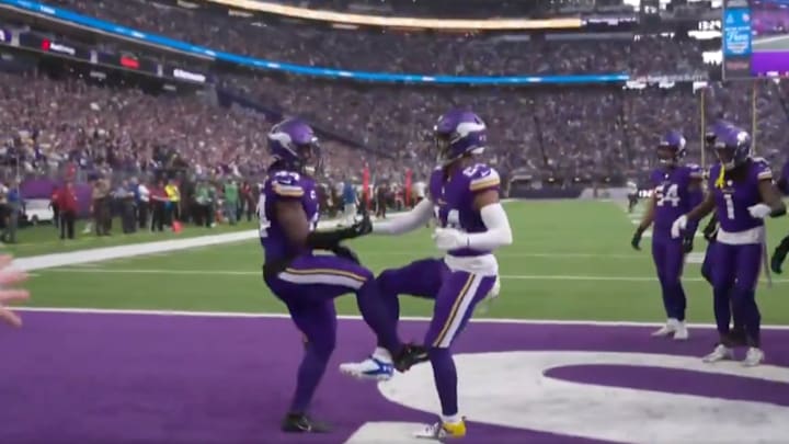 Josh Metellus and Camryn Bynum celebrate a Metellus interception. Josh Metellus and Camryn Bynum celebrate a Metellus interception.