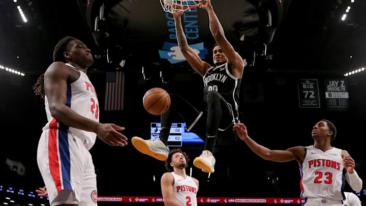Dec 23, 2023; Brooklyn, New York, USA; Brooklyn Nets center Nic Claxton (33) hangs on the rim 