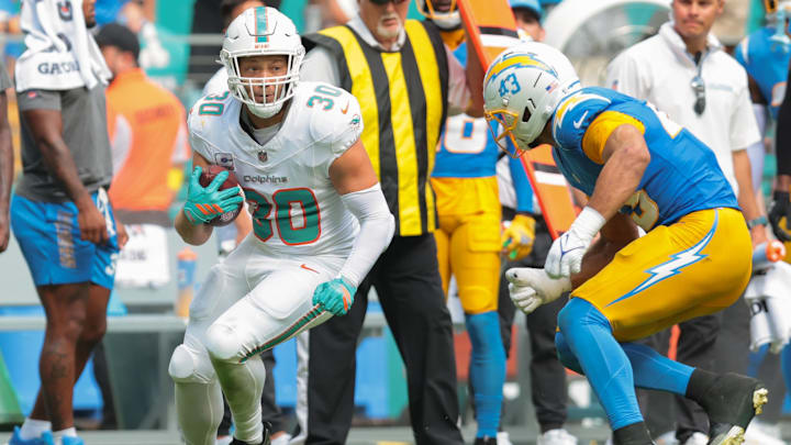 Miami Dolphins fullback Alec Ingold (30) carries the football against Los Angeles Chargers linebacker Troy Dye (43) during the fourth quarter at Hard Rock Stadium. Miami Dolphins fullback Alec Ingold (30) carries the football against Los Angeles Chargers linebacker Troy Dye (43) during the fourth quarter at Hard Rock Stadium.