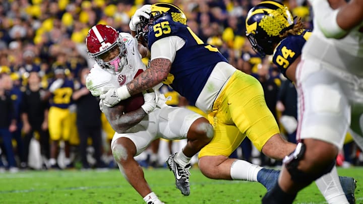 Jan 1, 2024; Pasadena, CA, USA; Michigan Wolverines defensive lineman Mason Graham (55) tackles Alabama Crimson Tide running back Jase McClellan (2) during overtime in the 2024 Rose Bowl college football playoff semifinal game at Rose Bowl.