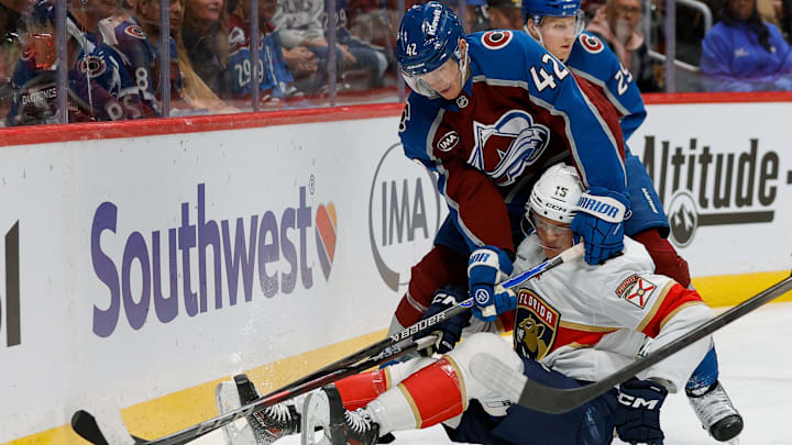 Dec 11, 2025; Denver, Colorado, USA; Florida Panthers center Anton Lundell (15) and Colorado Avalanche defenseman Josh Manson (42) battle for the puck in the first period at Ball Arena. Mandatory Credit: Isaiah J. Downing-Imagn Images Dec 11, 2025; Denver, Colorado, USA; Florida Panthers center Anton Lundell (15) and Colorado Avalanche defenseman Josh Manson (42) battle for the puck in the first period at Ball Arena. Mandatory Credit: Isaiah J. Downing-Imagn Images