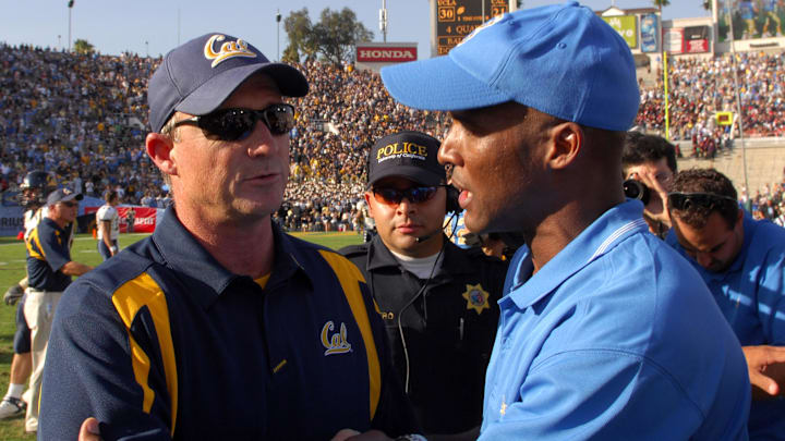 Jeff Tedford, left, greets UCLA coach Karl Dorrell