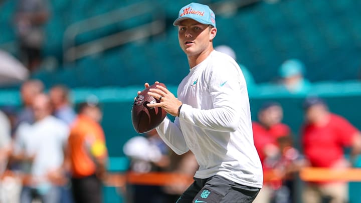 Miami Dolphins quarterback Zach Wilson (0) warms up before a game against the New England Patriots at Hard Rock Stadium.