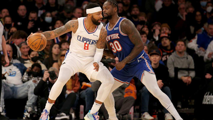 Jan 23, 2022; New York, New York, USA; Los Angeles Clippers forward Marcus Morris Sr. (8) controls the ball against New York Knicks forward Julius Randle (30) during the second quarter at Madison Square Garden. Mandatory Credit: Brad Penner-Imagn Images