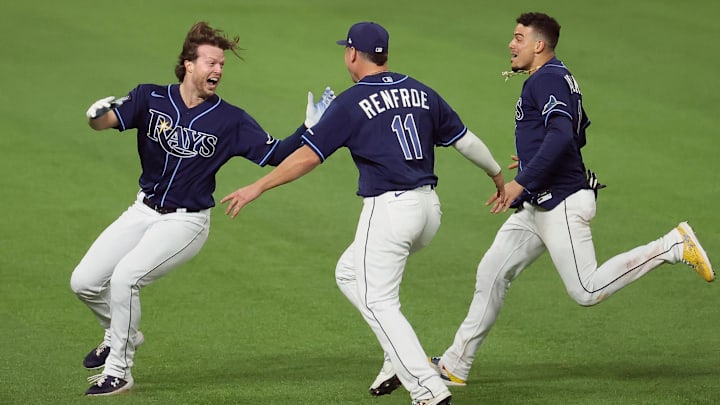 Tampa Bay's Brett Phillips (left) celebrates with Hunter Renfroe (11) and Willy Adames during the 2020 World Series.