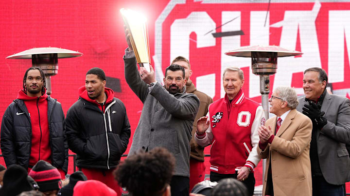 Ohio State Buckeyes head coach Ryan Day hoists the championship trophy during the Ohio State Buckeyes College Football Playoff National Championship celebration at Ohio Stadium in Columbus on Jan. 26, 2025.