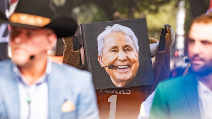 Texas mascot Hook 'Em wears the head of analyst Lee Corso, who wore a Hook 'Em head when he picked Texas to win during ESPN's College Game Day at the University of Texas on the South Mall ahead of the Longhorns' game against the Georgia Bulldogs in Austin, Oct. 19, 2024.