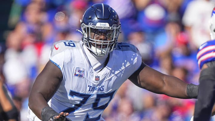 Oct 20, 2024; Orchard Park, New York, USA; Tennessee Titans center Lloyd Cushenberry III (79) looks to block against the Buffalo Bills during the first half at Highmark Stadium. Mandatory Credit: Gregory Fisher-Imagn Images