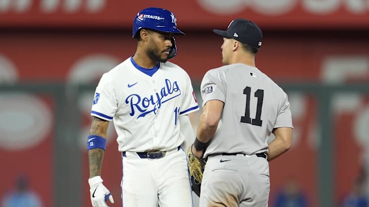 Oct 10, 2024; Kansas City, Missouri, USA; Kansas City Royals third baseman Maikel Garcia (11) stares down New York Yankees shortstop Anthony Volpe (11) following tagout at second base during the sixth inning during game four of the ALDS for the 2024 MLB Playoffs at Kauffman Stadium. Mandatory Credit: Jay Biggerstaff-Imagn Images