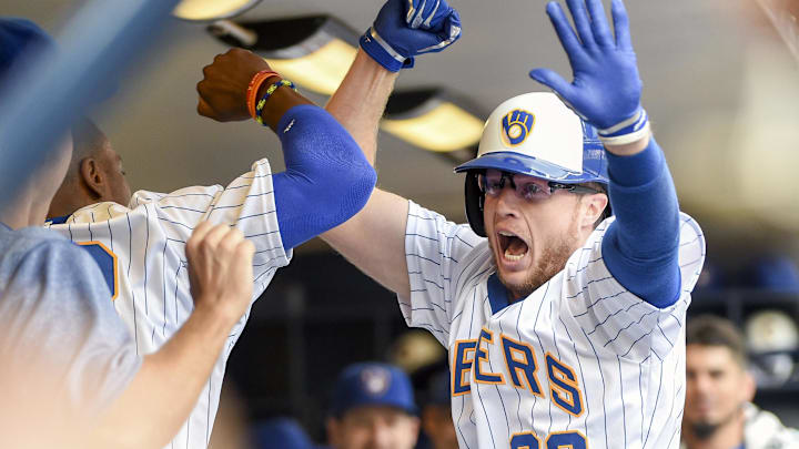 Jul 16, 2017; Milwaukee, WI, USA;  Milwaukee Brewers pinch hitter Brett Phillips (33) celebrates in the dugout after hitting a 2-run home run in the fifth inning against the Philadelphia Phillies at Miller Park. Mandatory Credit: Benny Sieu-Imagn Images