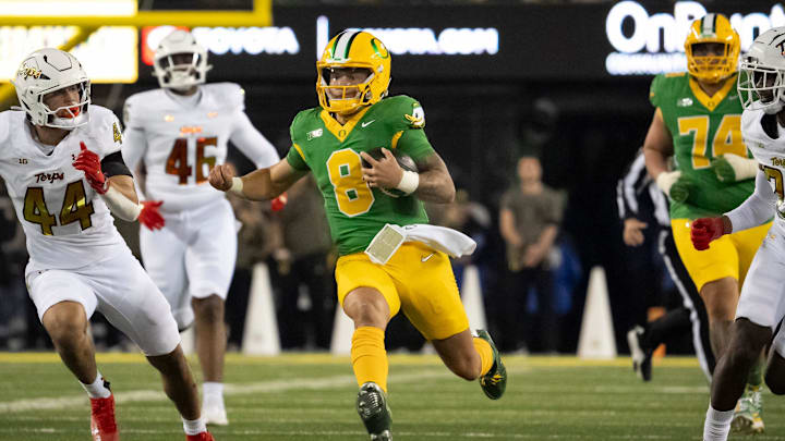 Oregon quarterback Dillon Gabriel carries the ball as the Oregon Ducks host the Maryland Terrapins at Autzen Stadium Saturday, Nov. 9, 2024 in Eugene, Ore.