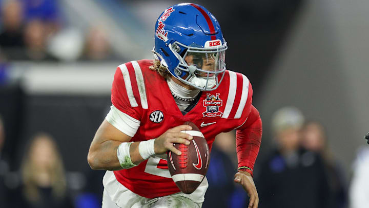Jan 2, 2025; Jacksonville, FL, USA; Mississippi Rebels quarterback Jaxson Dart (2) drops back to pass against the Duke Blue Devils in the second quarter  during the Gator Bowl at EverBank Stadium. Mandatory Credit: Nathan Ray Seebeck-Imagn Images
