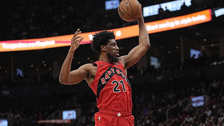 Jan 17, 2024; Toronto, Ontario, CAN; Toronto Raptors forward Thaddeus Young (21) comes down with a rebound against the Miami Heat during the first half at Scotiabank Arena. Mandatory Credit: John E. Sokolowski-Imagn Images