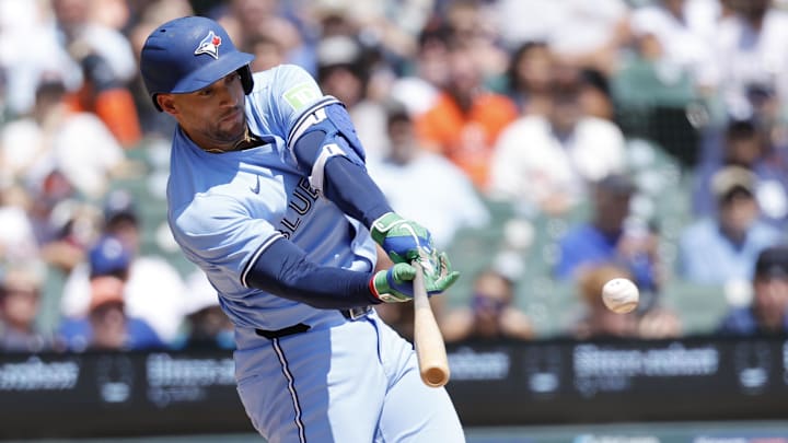 Jul 27, 2025; Detroit, Michigan, USA;  Toronto Blue Jays outfielder George Springer (4) hits a single in the third inning against the Detroit Tigers at Comerica Park. 