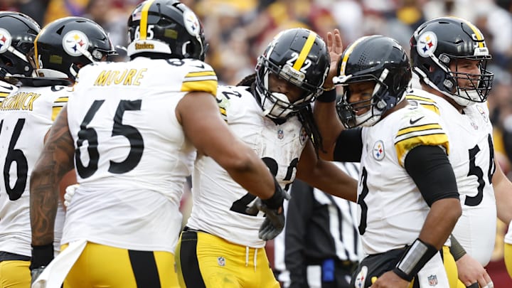 Nov 10, 2024; Landover, Maryland, USA; Pittsburgh Steelers running back Najee Harris (22) celebrates with Steelers quarterback Russell Wilson (3) after scoring a touchdown against the Washington Commanders during the second half at Northwest Stadium. Mandatory Credit: Geoff Burke-Imagn Images