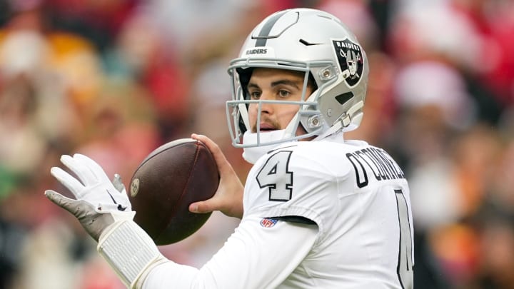 Dec 25, 2023; Kansas City, Missouri, USA; Las Vegas Raiders quarterback Aidan O'Connell (4) throws a pass during the first half against the Kansas City Chiefs at GEHA Field at Arrowhead Stadium. Mandatory Credit: Jay Biggerstaff-USA TODAY Sports