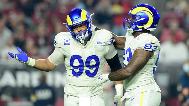 Dec 13, 2021; Glendale, Arizona, USA; Los Angeles Rams defensive end Aaron Donald (99) celebrates a sack with defensive tackle Marquise Copeland (93) against the Arizona Cardinals during the first half at State Farm Stadium. Mandatory Credit: Joe Camporeale-USA TODAY Sports Dec 13, 2021; Glendale, Arizona, USA; Los Angeles Rams defensive end Aaron Donald (99) celebrates a sack with defensive tackle Marquise Copeland (93) against the Arizona Cardinals during the first half at State Farm Stadium. Mandatory Credit: Joe Camporeale-USA TODAY Sports