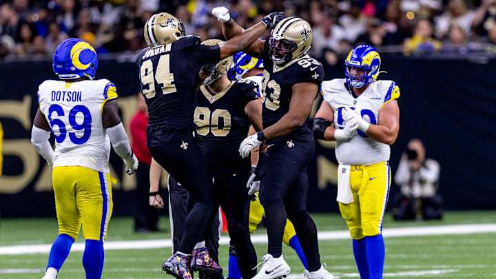 Dec 1, 2024; New Orleans, Louisiana, USA;  New Orleans Saints defensive tackle Nathan Shepherd (93) sacks Los Angeles Rams quarterback Matthew Stafford (9) during the first half at Caesars Superdome. Mandatory Credit: Stephen Lew-Imagn Images