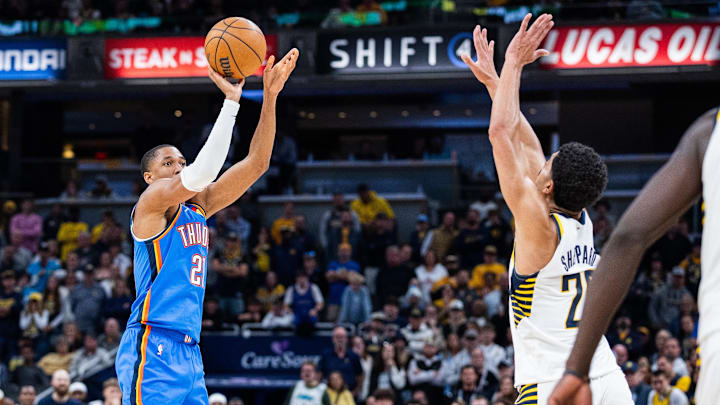 Oct 23, 2025; Indianapolis, Indiana, USA;  Oklahoma City Thunder guard Aaron Wiggins (21) shoots the ball while  Indiana Pacers guard Ben Sheppard (26) defends in the second half at Gainbridge Fieldhouse. Mandatory Credit: Trevor Ruszkowski-Imagn Images