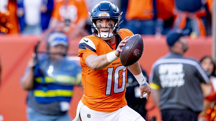 DENVER, CO - OCTOBER 19: Bo Nix scores a touchdown vs. the New York Giants. DENVER, CO - OCTOBER 19: Bo Nix scores a touchdown vs. the New York Giants.