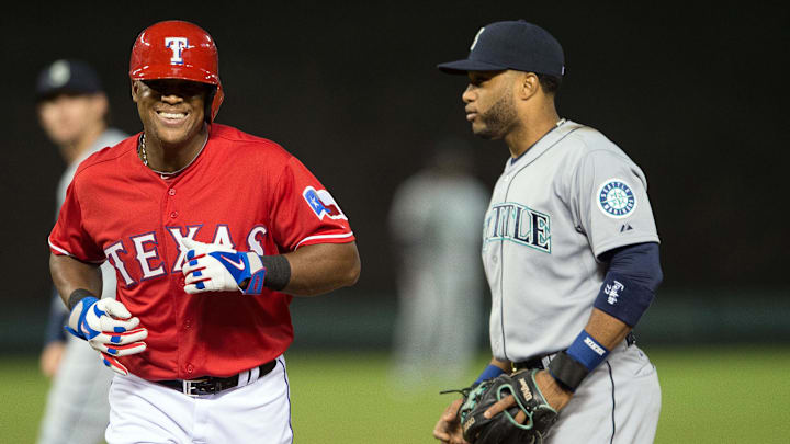 Apr 27, 2015; Arlington, TX, USA; Texas Rangers third baseman Adrian Beltre (29) runs past Seattle Mariners second baseman Robinson Cano (22) after called out for being hit with a live ball during the fourth inning at Globe Life Park in Arlington. Mandatory Credit: Jerome Miron-Imagn Images Apr 27, 2015; Arlington, TX, USA; Texas Rangers third baseman Adrian Beltre (29) runs past Seattle Mariners second baseman Robinson Cano (22) after called out for being hit with a live ball during the fourth inning at Globe Life Park in Arlington. Mandatory Credit: Jerome Miron-Imagn Images