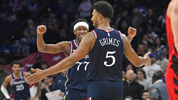 Mar 15, 2026; Philadelphia, Pennsylvania, USA; Philadelphia 76ers guard Vj Edgecombe (77) and guard Quentin Grimes (5) celebrate win against the Portland Trail Blazers during the second half at Xfinity Mobile Arena. Mandatory Credit: Eric Hartline-Imagn Images