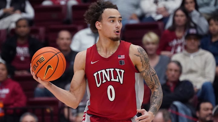 UNLV Runnin' Rebels guard Dra Gibbs-Lawhorn (0) dribbles upcourt against the Stanford Cardinal in the second half at Maples Pavilion. Mandatory Credit: David Gonzales-Imagn Images