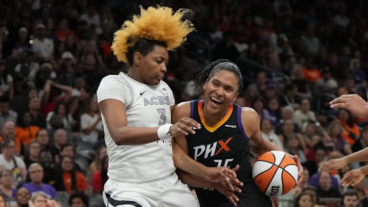 Aug 15, 2025; Phoenix, Arizona, USA; Phoenix Mercury forward Alyssa Thomas (25) drives on Las Vegas Aces forward NaLyssa Smith (3) in the second half at Footprint Center. Mandatory Credit: Rick Scuteri-Imagn Images
