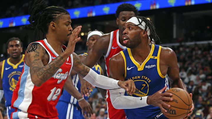 Apr 1, 2025; Memphis, Tennessee, USA; Golden State Warriors guard Buddy Hield (7) drives to the basket as Memphis Grizzlies guard Ja Morant (12) defends during the third quarter at FedExForum. Mandatory Credit: Petre Thomas-Imagn Images Apr 1, 2025; Memphis, Tennessee, USA; Golden State Warriors guard Buddy Hield (7) drives to the basket as Memphis Grizzlies guard Ja Morant (12) defends during the third quarter at FedExForum. Mandatory Credit: Petre Thomas-Imagn Images