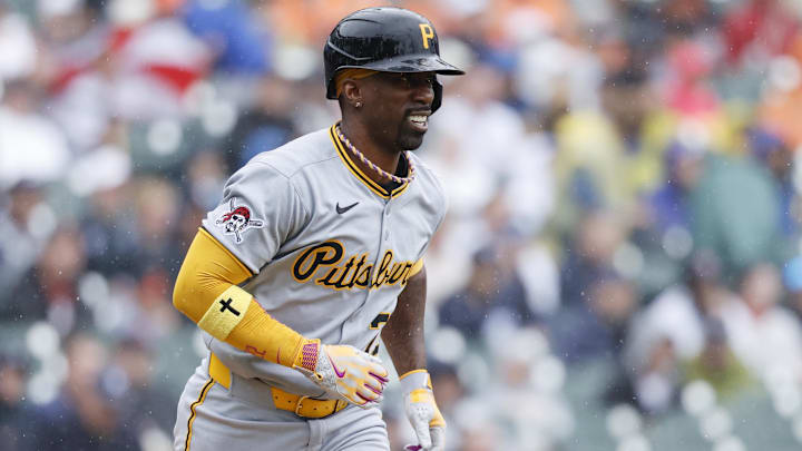 Jun 19, 2025; Detroit, Michigan, USA;  Pittsburgh Pirates designated hitter runs to first after he hits a single in the first inning against the Detroit Tigers  Andrew McCutchen (22) at Comerica Park. Mandatory Credit: Rick Osentoski-Imagn Images