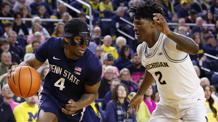 Penn State Nittany Lions guard Kayden Mingo dribbles against Michigan Wolverines guard L.J. Cason during a Big Ten basketball game. 