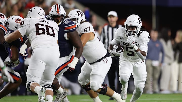 Texas A&M Aggies running back Amari Daniels (5) carries against the Auburn Tigers during the first quarter at Jordan-Hare Stadium.