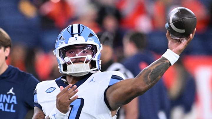 Oct 31, 2025; Syracuse, New York, USA; North Carolina Tar Heels quarterback Gio Lopez (7) warms up before a game against the Syracuse Orange at the JMA Wireless Dome. Mandatory Credit: Mark Konezny-Imagn Images