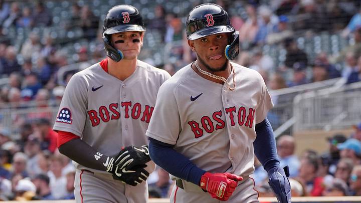 Apr 15, 2026; Minneapolis, Minnesota, USA; Boston Red Sox right fielder Roman Anthony (left) and center fielder Ceddanne Rafaela return to the dugout after scoring against the Minnesota Twins in the sixth inning on a double by shortstop Trevor Story (not pictured) at Target Field. Mandatory Credit: Bruce Kluckhohn-Imagn Images