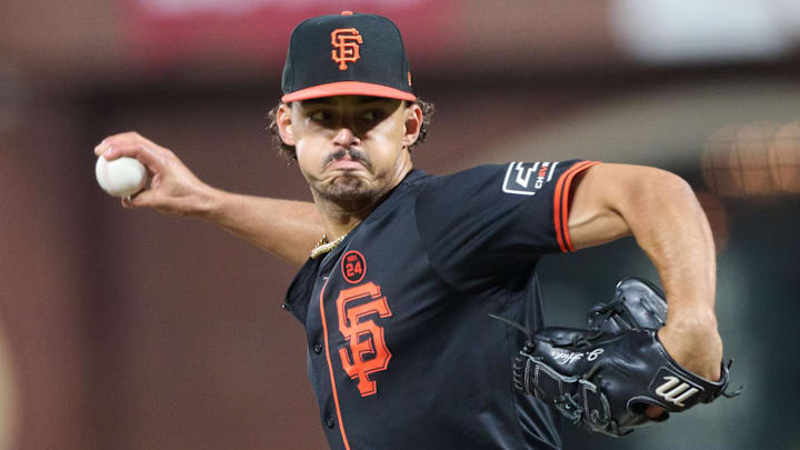 Sep 14, 2024; San Francisco, California, USA; San Francisco Giants pitcher Jordan Hicks (12) throws a pitch against the San Diego Padres during the seventh inning at Oracle Park. Sep 14, 2024; San Francisco, California, USA; San Francisco Giants pitcher Jordan Hicks (12) throws a pitch against the San Diego Padres during the seventh inning at Oracle Park.