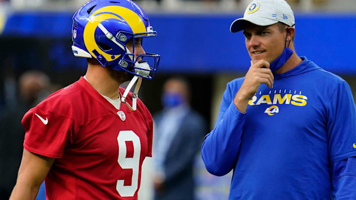 Jun 10, 2021; Los Angeles, CA, USA; Los Angeles Rams quarterback Matthew Stafford (9) talks to offensive coordinator Kevin O'Connell during an offseason workout at SoFi Stadium. Mandatory Credit: Robert Hanashiro-Imagn Images
