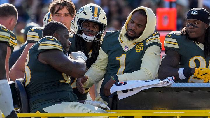 Green Bay Packers defensive end Micah Parsons (1) checks on defensive tackle Javon Hargrave (98) after his torn Achilles. Green Bay Packers defensive end Micah Parsons (1) checks on defensive tackle Javon Hargrave (98) after his torn Achilles.