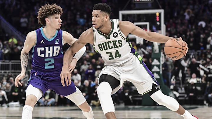Dec 1, 2021; Milwaukee, Wisconsin, USA;  Milwaukee Bucks forward Giannis Antetokounmpo (34) drives for the basket against Charlotte Hornets guard LaMelo Ball (2) in the fourth quarter at Fiserv Forum. Mandatory Credit: Benny Sieu-Imagn Images